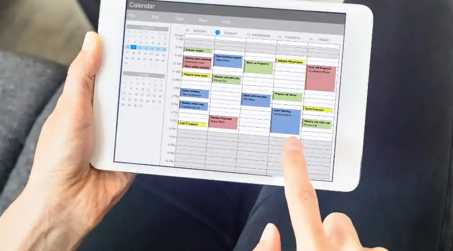 Doctor and therapist use practice management software called PsychOnline to schedule patient appointments on their calendar